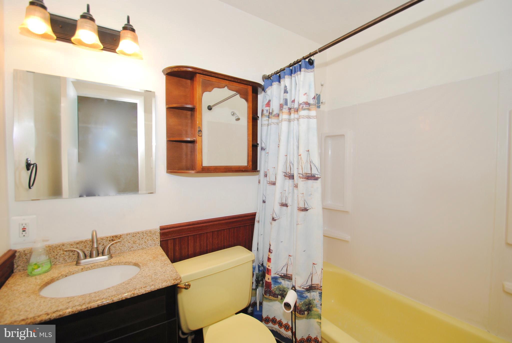 3003 Marlin Drive Riva, MD 21140 - Photo 20 of 36 a bathroom with a sink mirror vanity and toilet