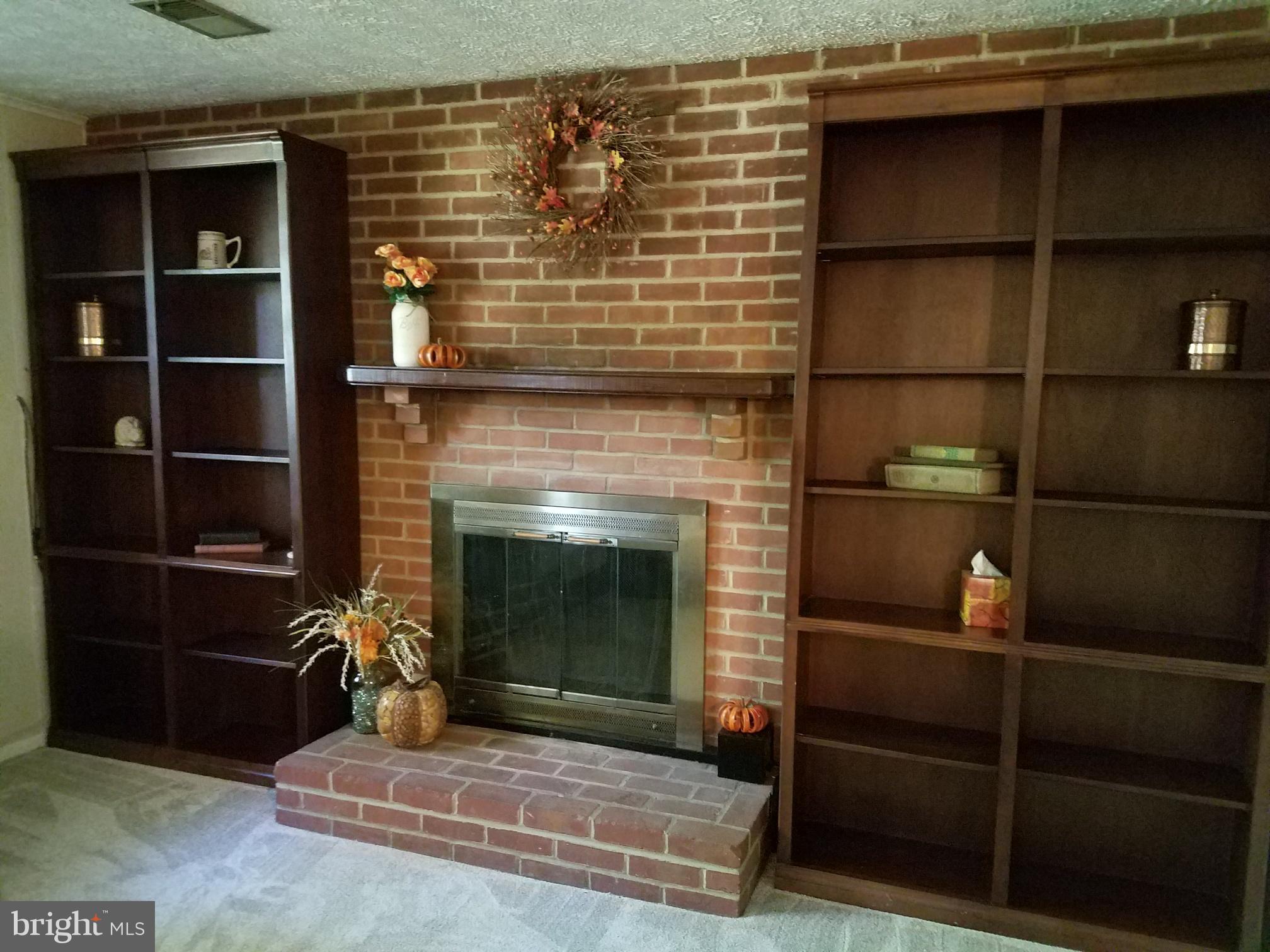 3003 Marlin Drive Riva, MD 21140 - Photo 3 of 36 a living room with a fireplace