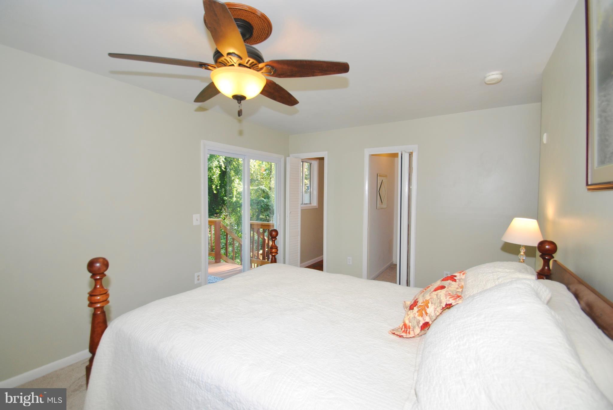 3003 Marlin Drive Riva, MD 21140 - Photo 23 of 36 a bedroom with a bed and a chandelier