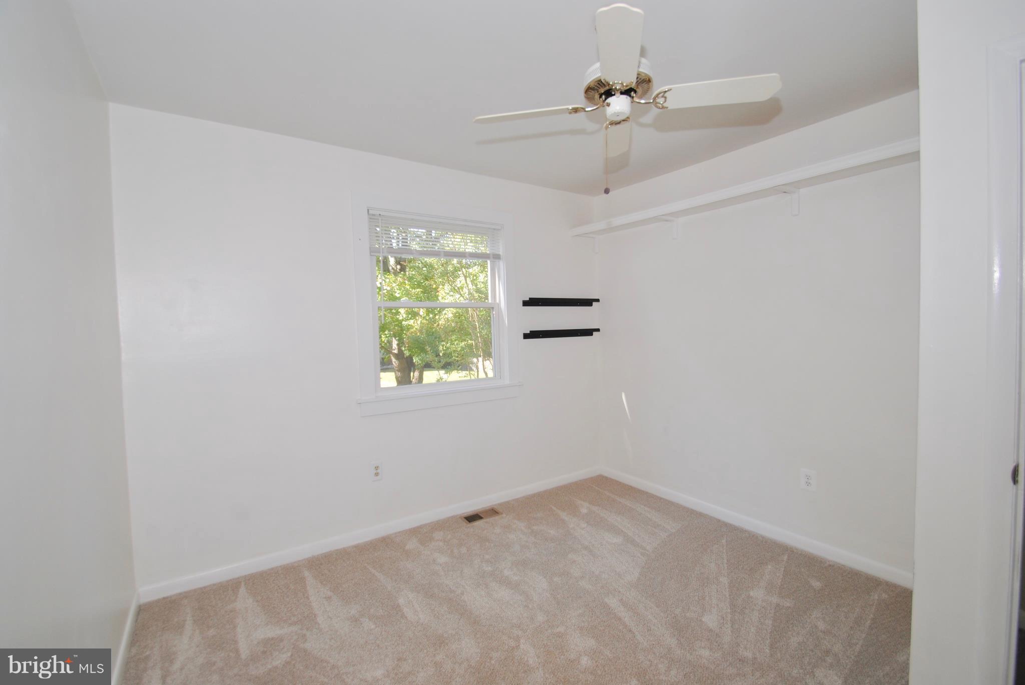3003 Marlin Drive Riva, MD 21140 - Photo 27 of 36 an empty room with windows and fan