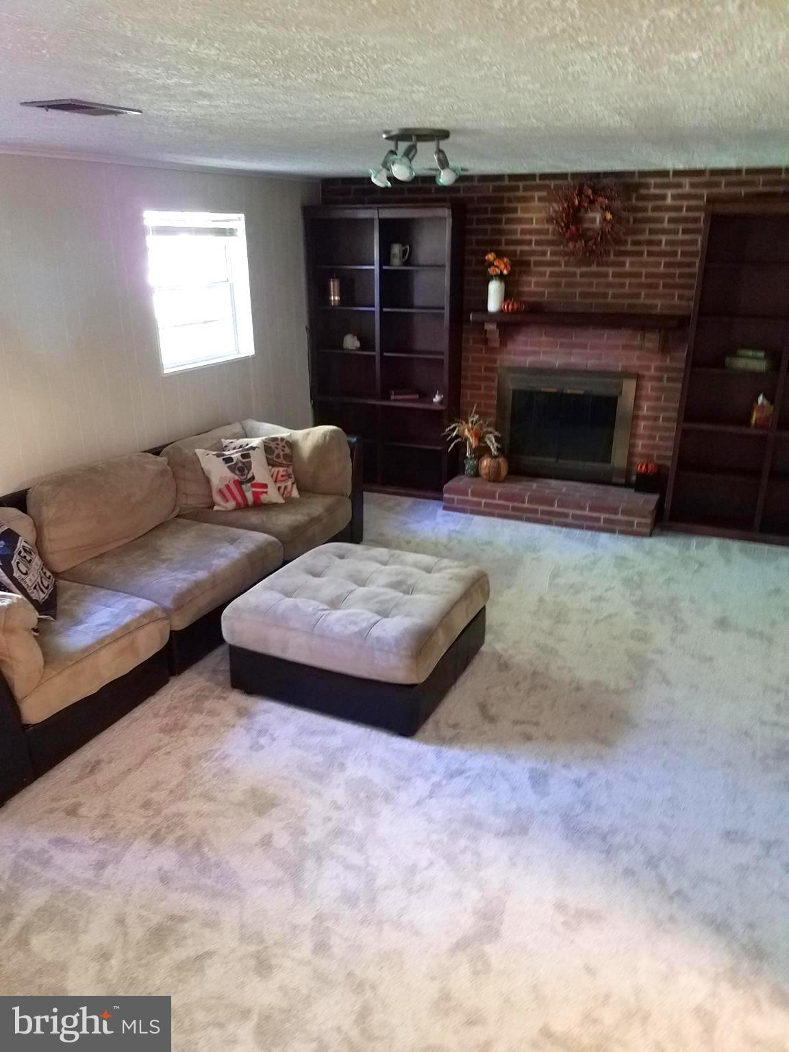 3003 Marlin Drive Riva, MD 21140 - Photo 36 of 36 a living room with couches and a fireplace