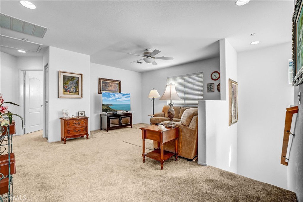 65 Windward Way Buena Park, CA 90621 - Photo 22 of 50 a living room with furniture and a flat screen tv