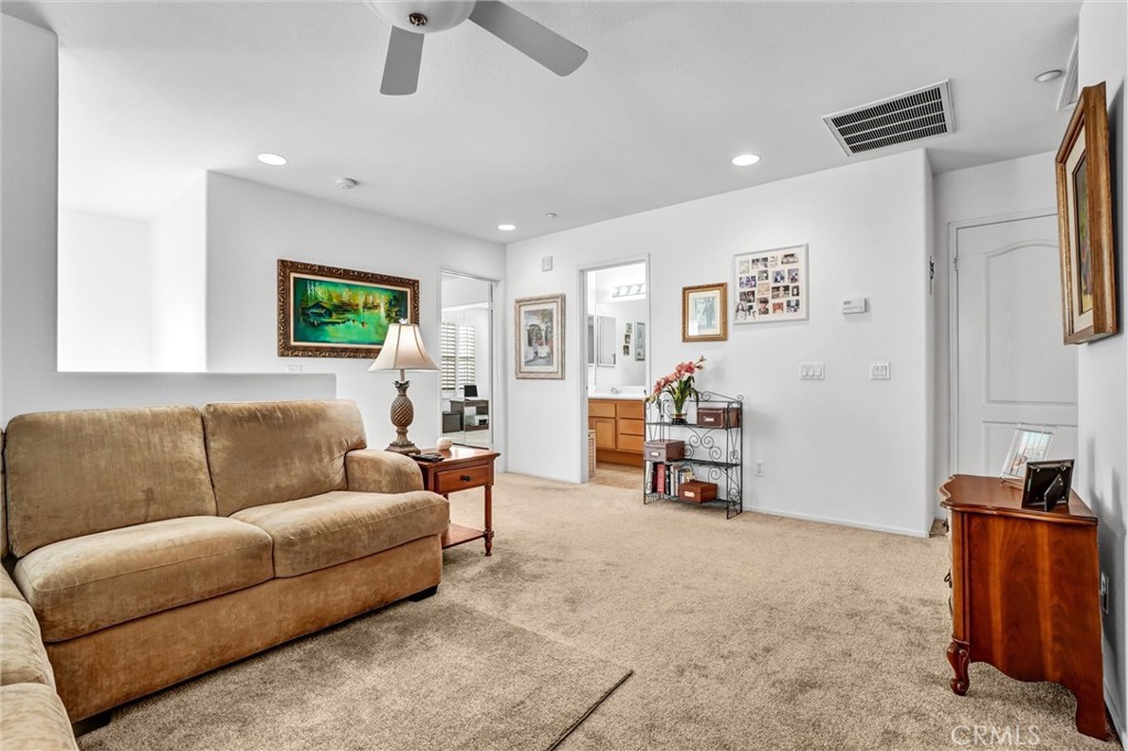 65 Windward Way Buena Park, CA 90621 - Photo 26 of 50 a living room with furniture and a flat screen tv