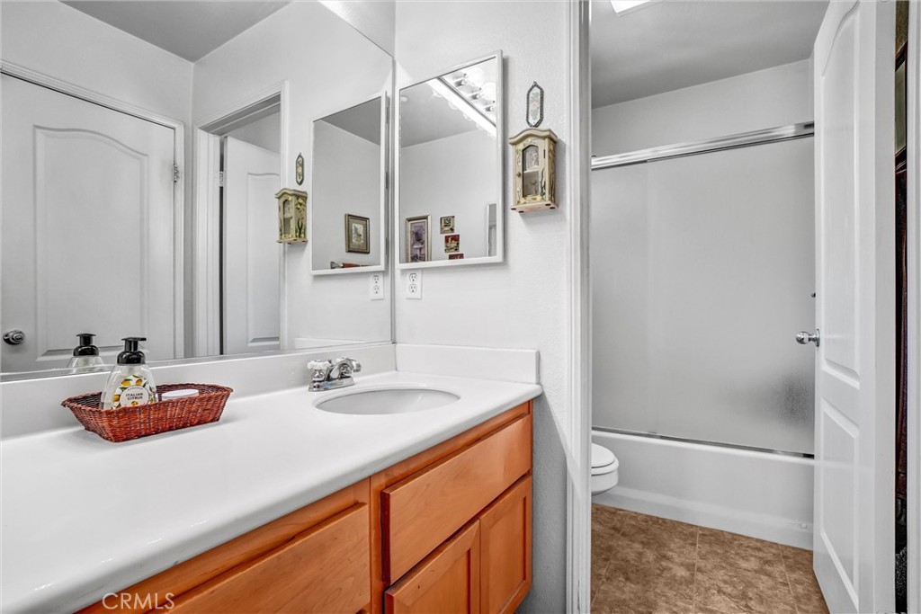 65 Windward Way Buena Park, CA 90621 - Photo 33 of 50 a bathroom with a sink and a mirror