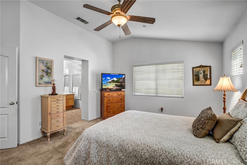 65 Windward Way Buena Park, CA 90621 - Photo 37 of 50 a bedroom with a bed and a window