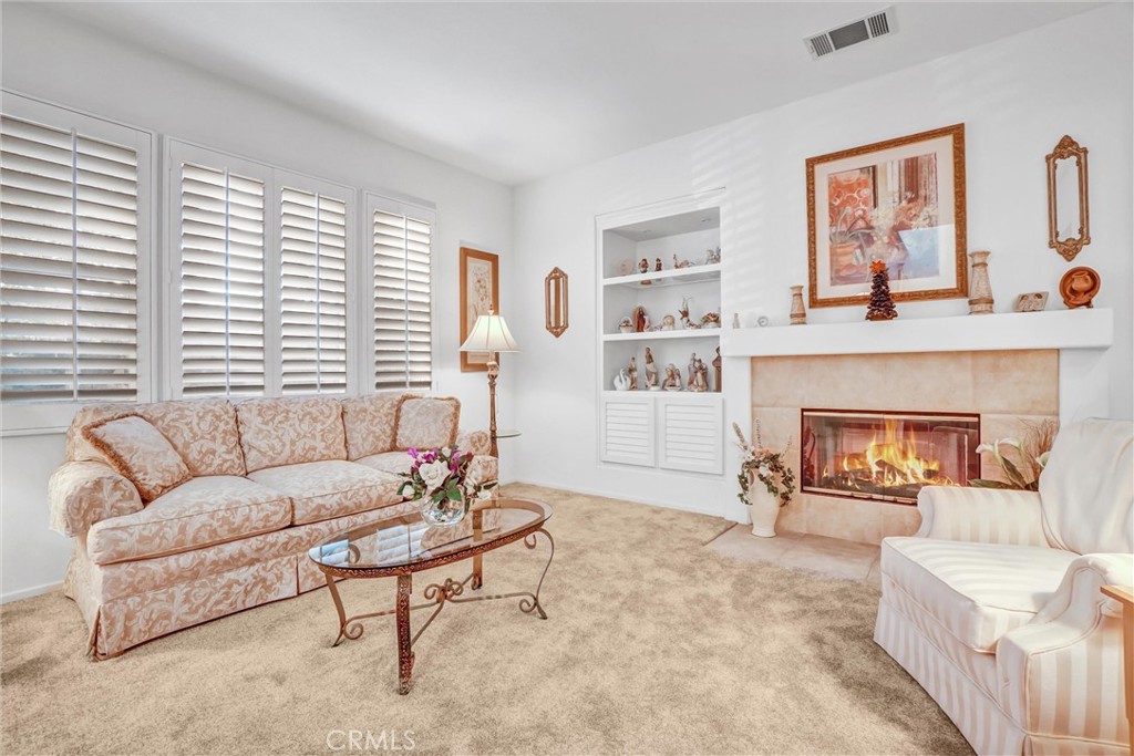 65 Windward Way Buena Park, CA 90621 - Photo 7 of 50 a living room with furniture and a fireplace