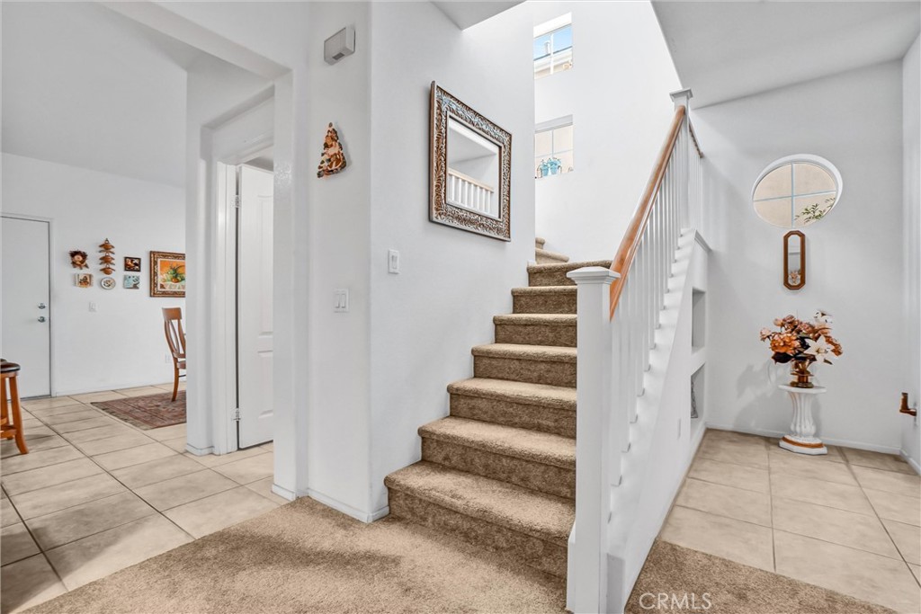 65 Windward Way Buena Park, CA 90621 - Photo 10 of 50 a view of an entryway with wooden floor and windows