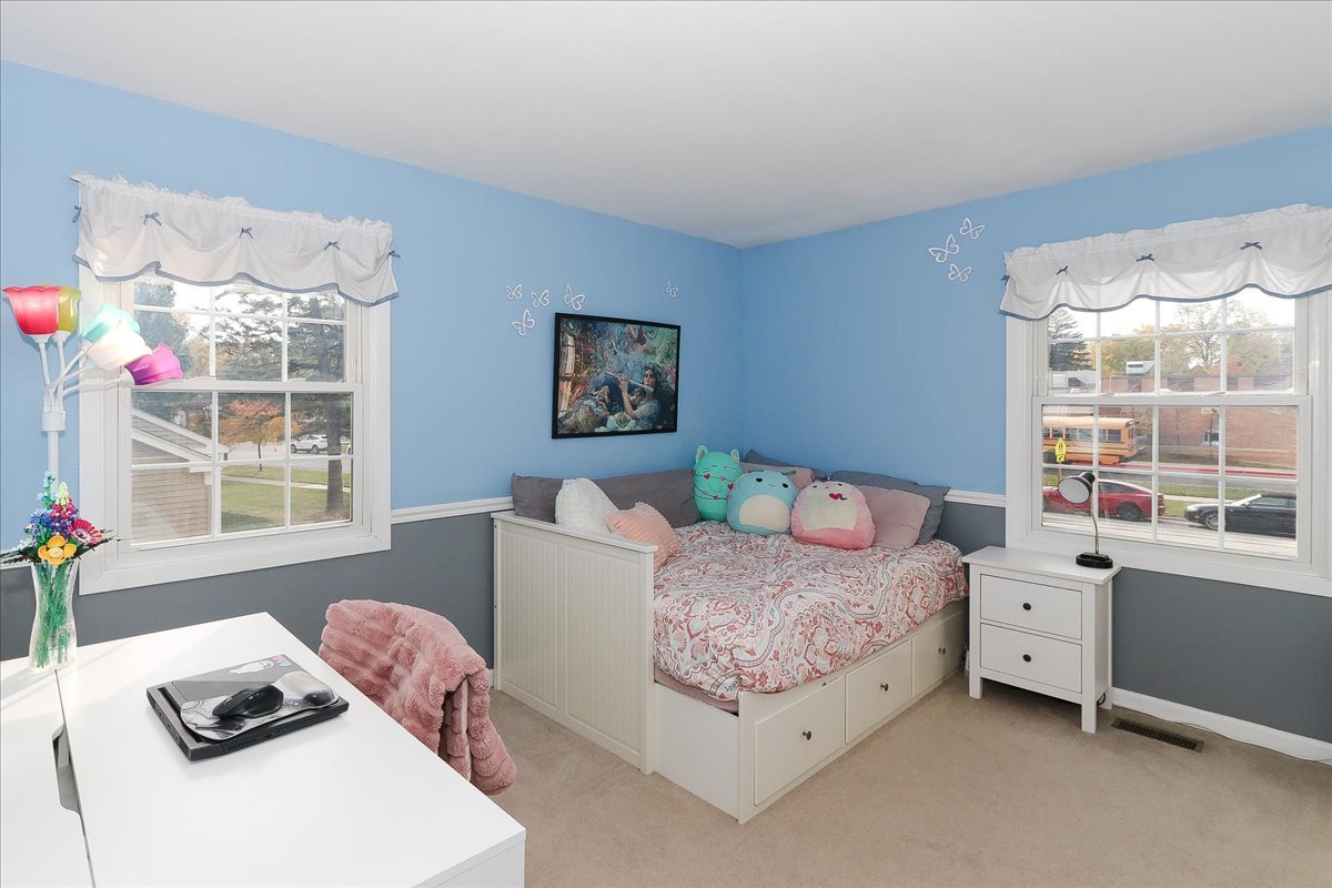 760 Checker Drive Buffalo Grove, IL 60089 - Photo 14 of 29 a bedroom with a bed and a window