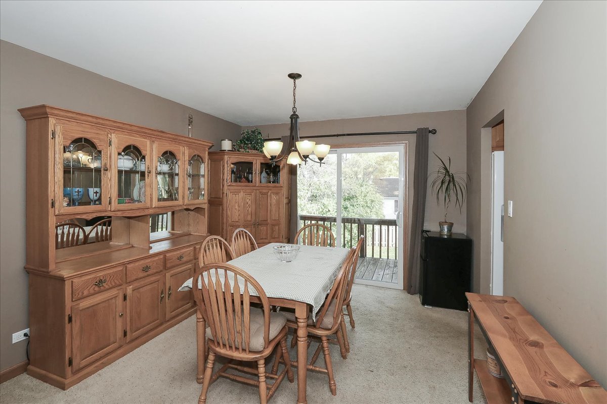 760 Checker Drive Buffalo Grove, IL 60089 - Photo 6 of 29 a view of a dining room with furniture window and outside view