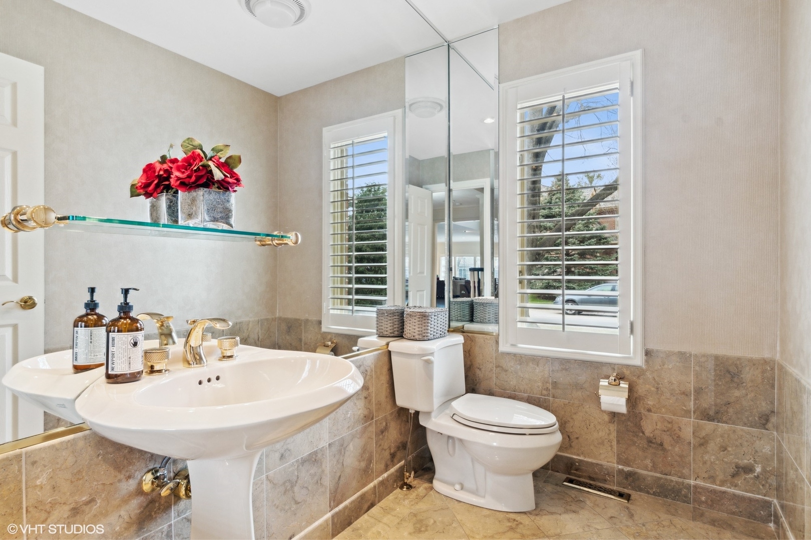 1049 Mar Ln Drive Lake Forest, IL 60045 - Photo 12 of 25 a bathroom with a toilet a sink and a mirror