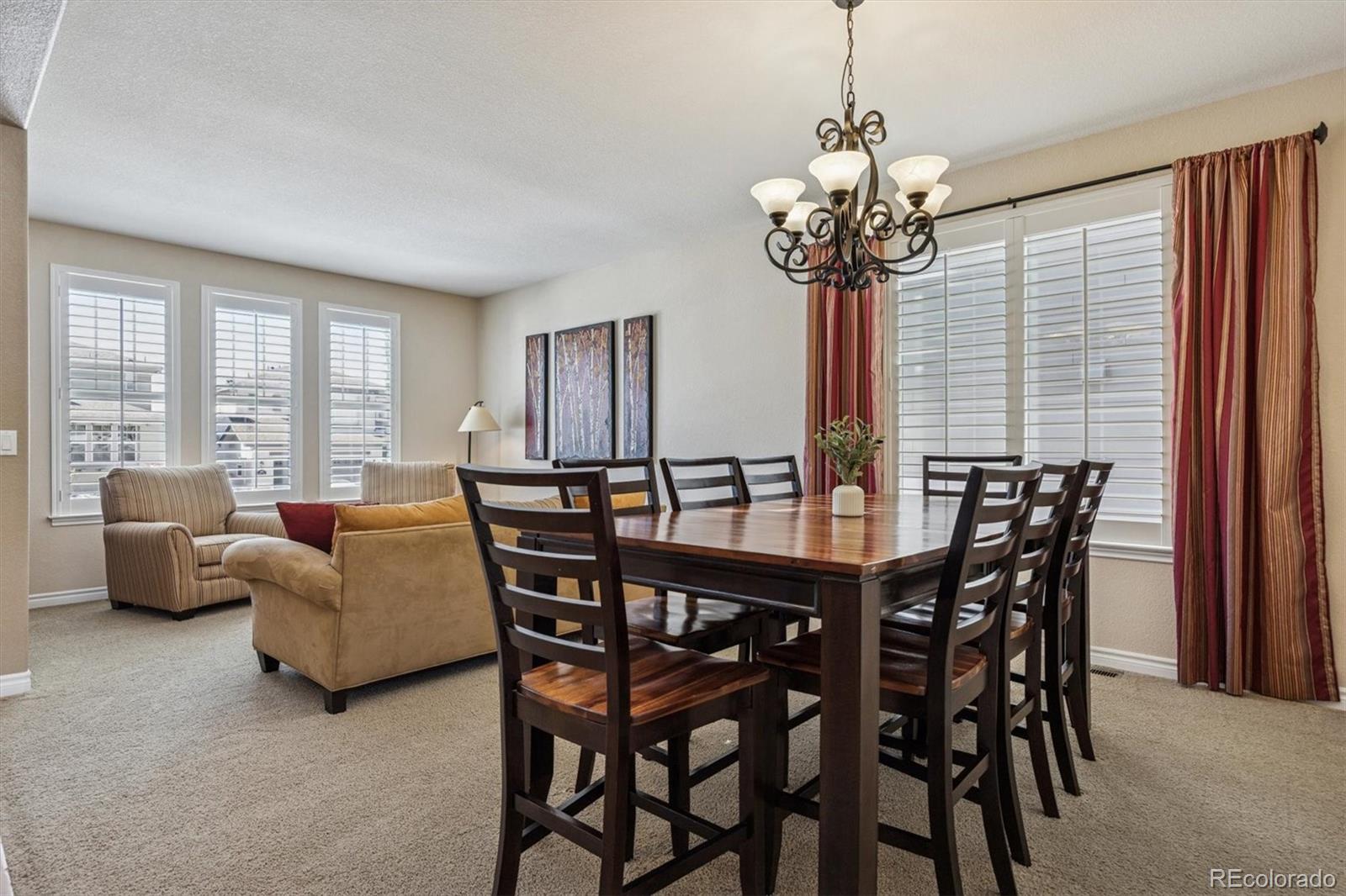 10822 Glengate Circle Highlands Ranch, CO 80130 - Photo 14 of 47 a view of a dining room with furniture and window