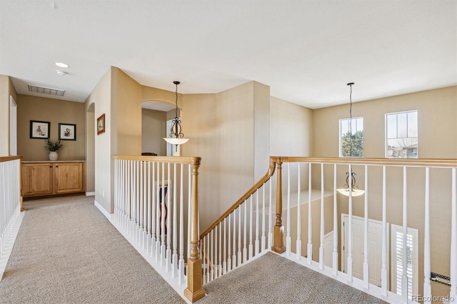 10822 Glengate Circle Highlands Ranch, CO 80130 - Photo 16 of 47 a view of a hallway with windows and entryway