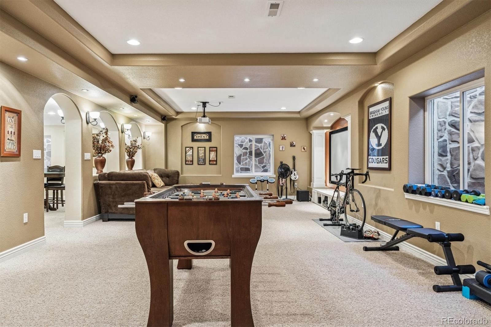 10822 Glengate Circle Highlands Ranch, CO 80130 - Photo 28 of 47 a view of a livingroom with furniture and a gym