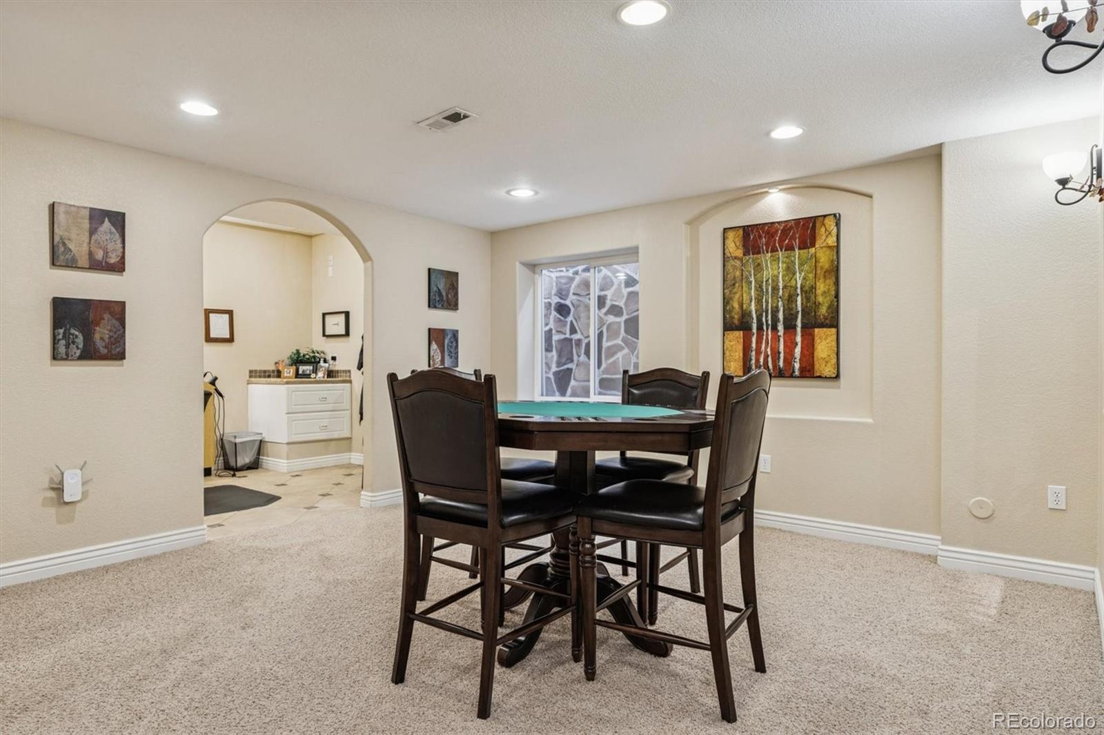 10822 Glengate Circle Highlands Ranch, CO 80130 - Photo 34 of 47 a view of a dining room with furniture and a window