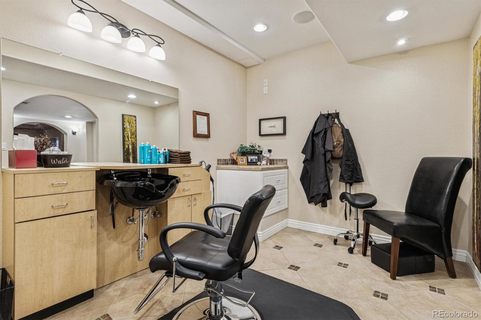 10822 Glengate Circle Highlands Ranch, CO 80130 - Photo 35 of 47 a view of a dining room with furniture and a chandelier