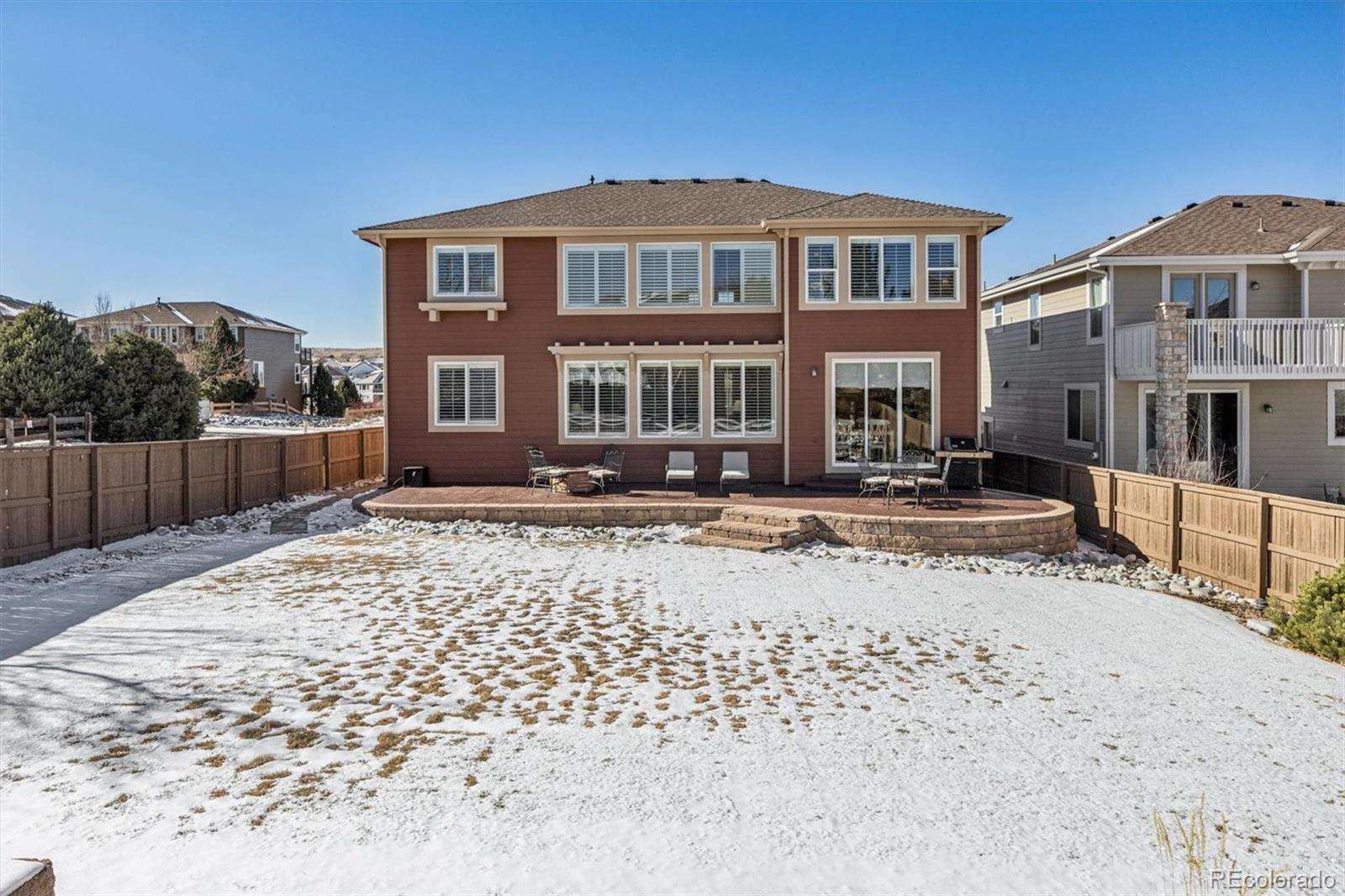 10822 Glengate Circle Highlands Ranch, CO 80130 - Photo 37 of 47 a front view of a house with a yard
