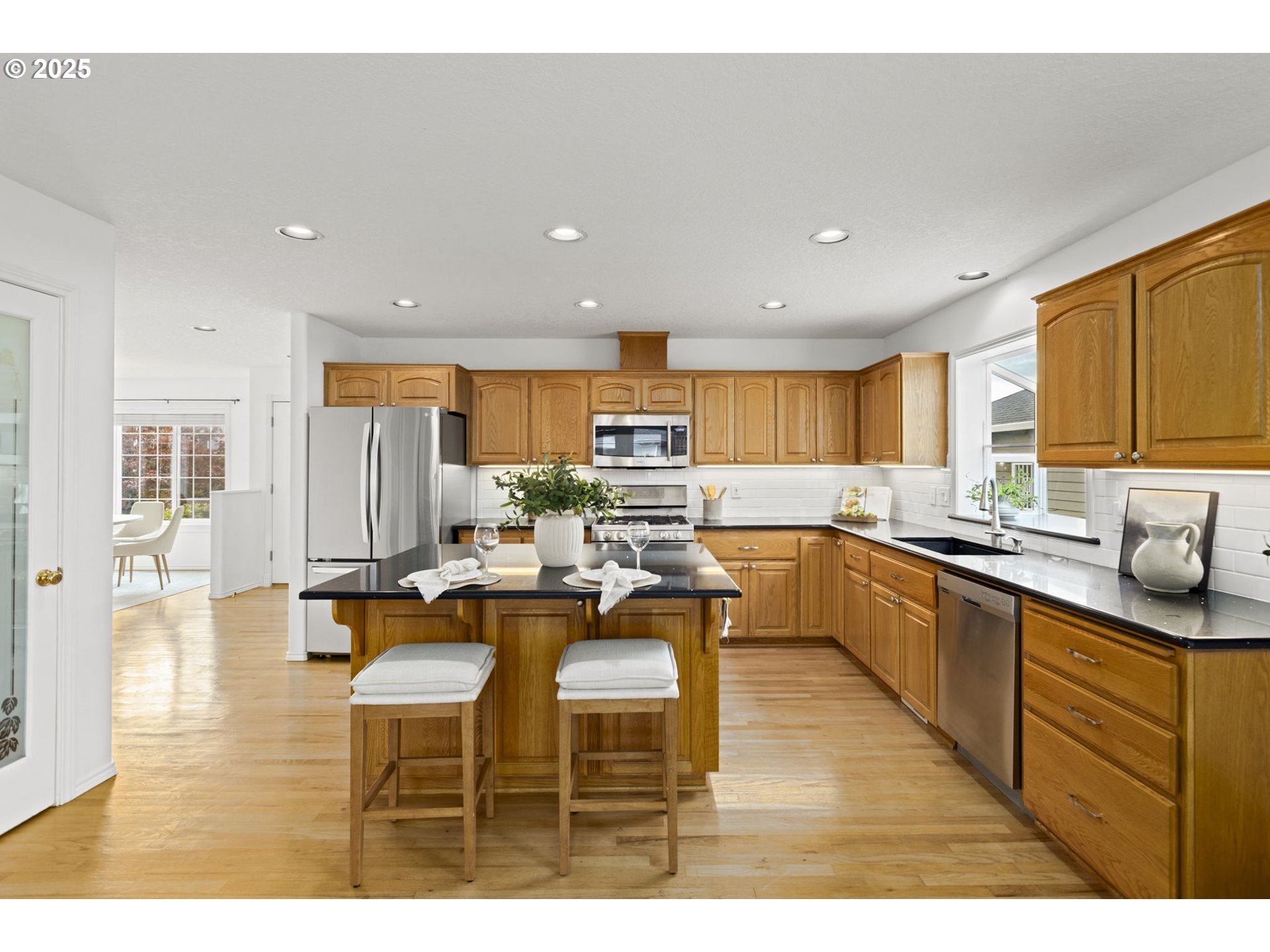 22271 Northeast Lachenview Lane Fairview, OR 97024 - Photo 11 of 40 a kitchen with counter top space a sink appliances and cabinets