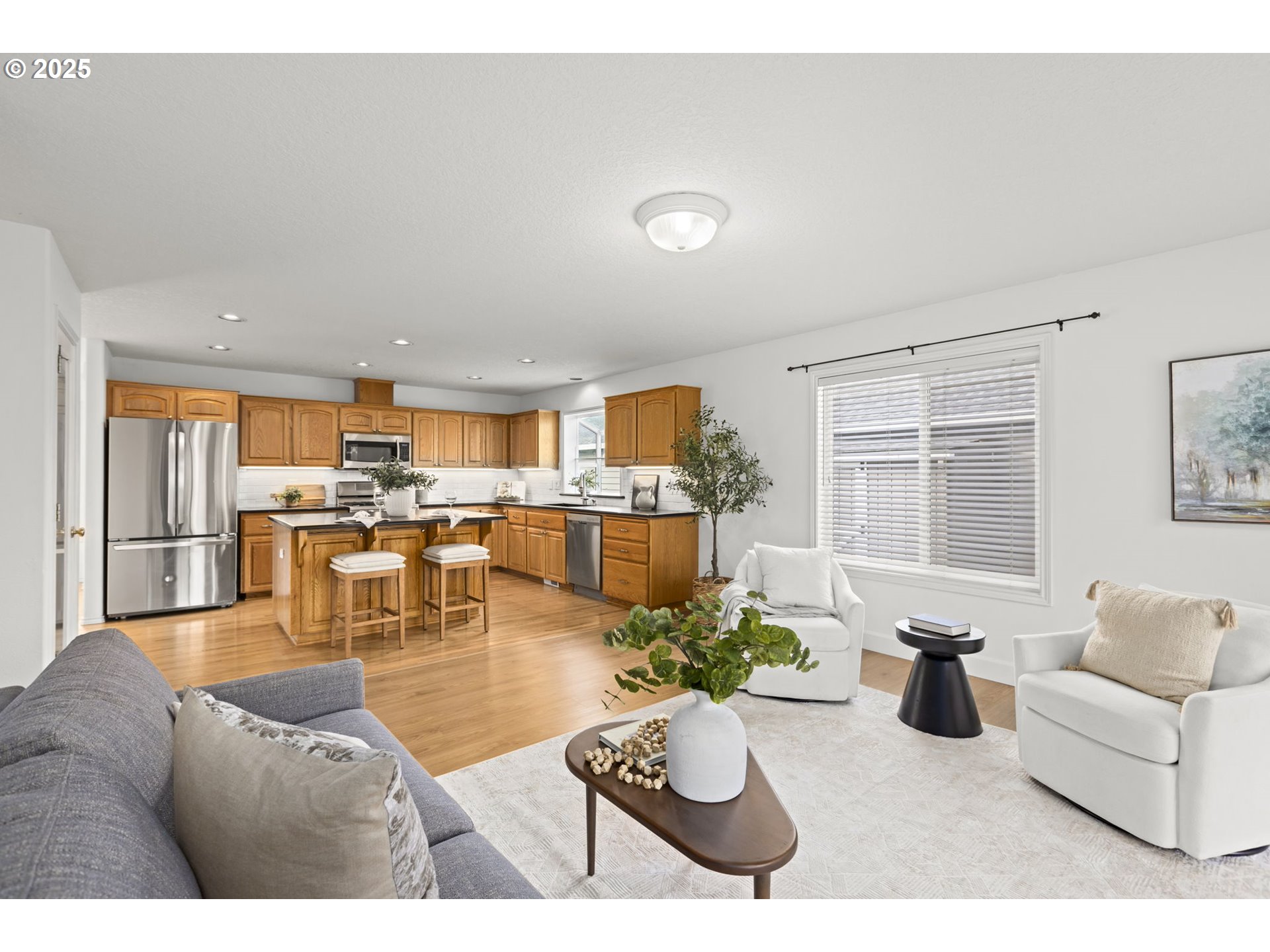 22271 Northeast Lachenview Lane Fairview, OR 97024 - Photo 15 of 40 a living room with furniture kitchen view and large windows