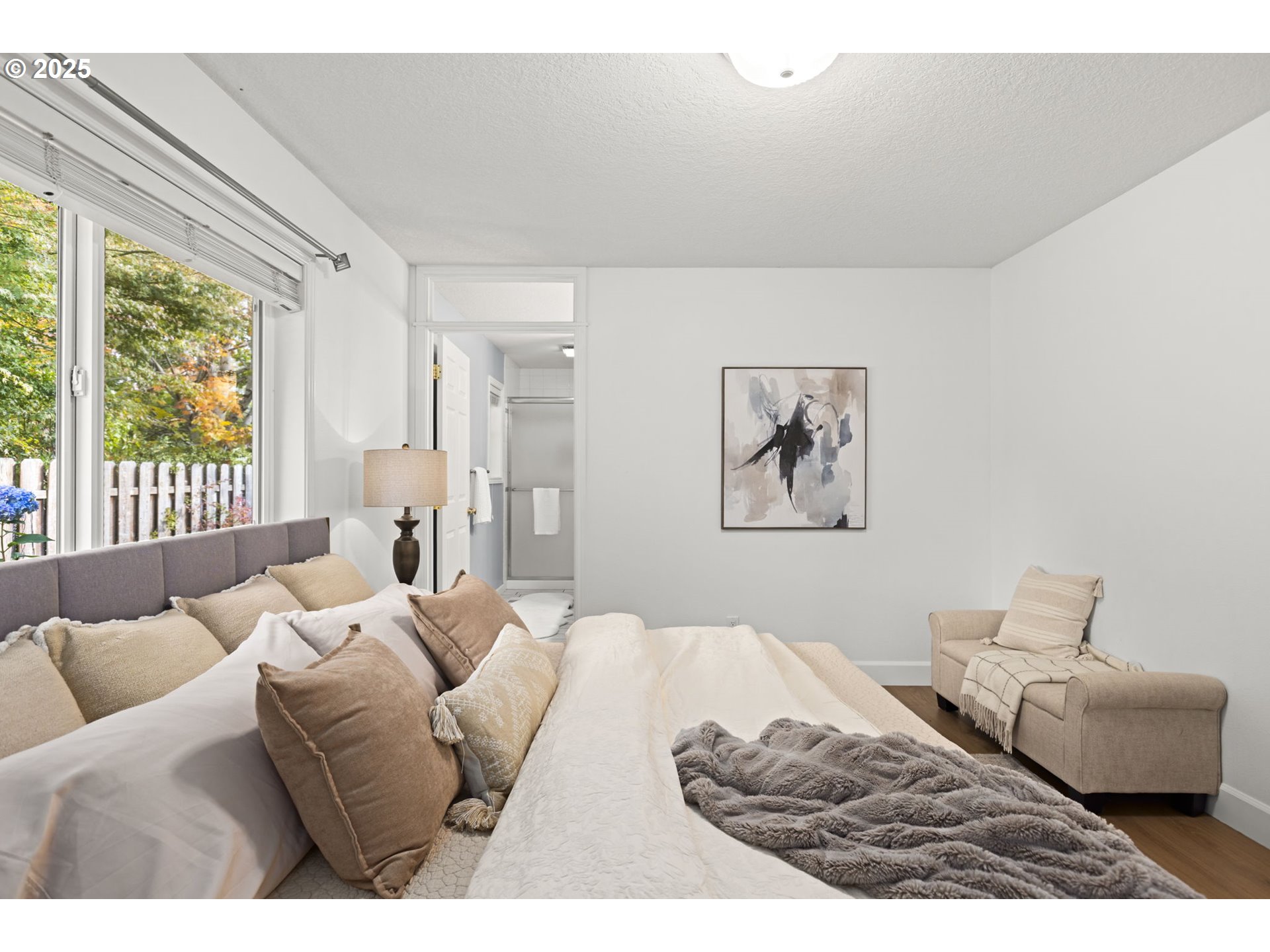 22271 Northeast Lachenview Lane Fairview, OR 97024 - Photo 18 of 40 a bedroom with furniture and a large window