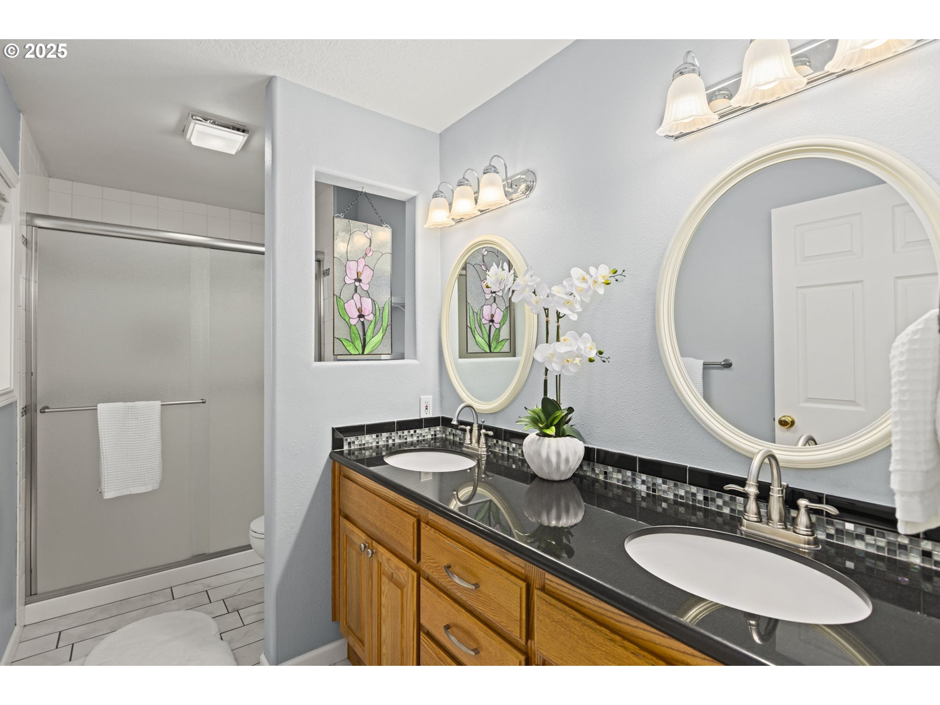22271 Northeast Lachenview Lane Fairview, OR 97024 - Photo 21 of 40 a bathroom with a double vanity sink and a mirror