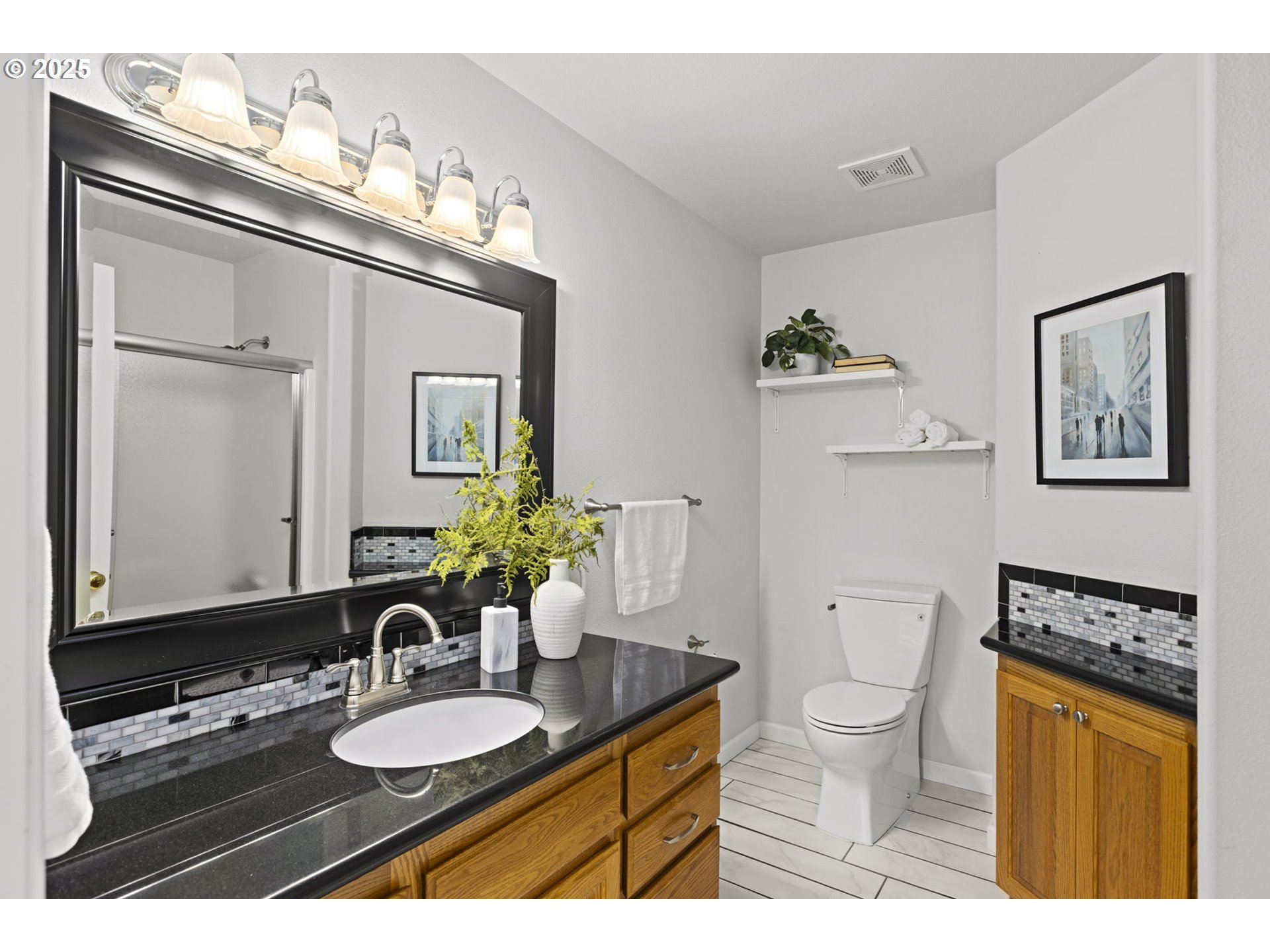 22271 Northeast Lachenview Lane Fairview, OR 97024 - Photo 25 of 40 a bathroom with a granite countertop sink toilet a mirror and shower
