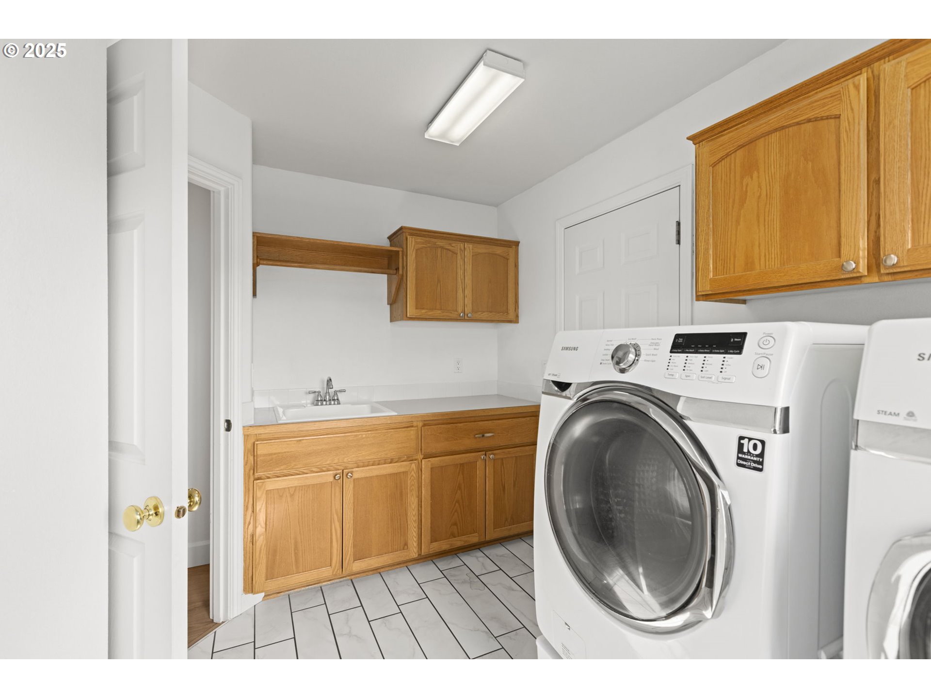 22271 Northeast Lachenview Lane Fairview, OR 97024 - Photo 28 of 40 a view of a kitchen with sink washer and dryer