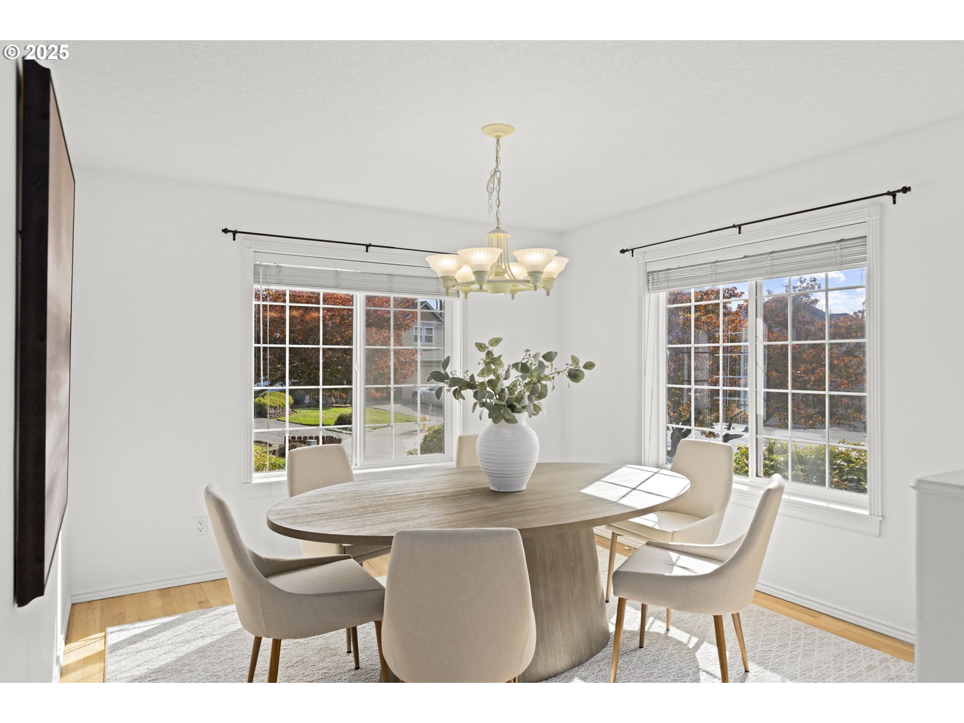 22271 Northeast Lachenview Lane Fairview, OR 97024 - Photo 8 of 40 a dining room with furniture a potted plant and a chandelier