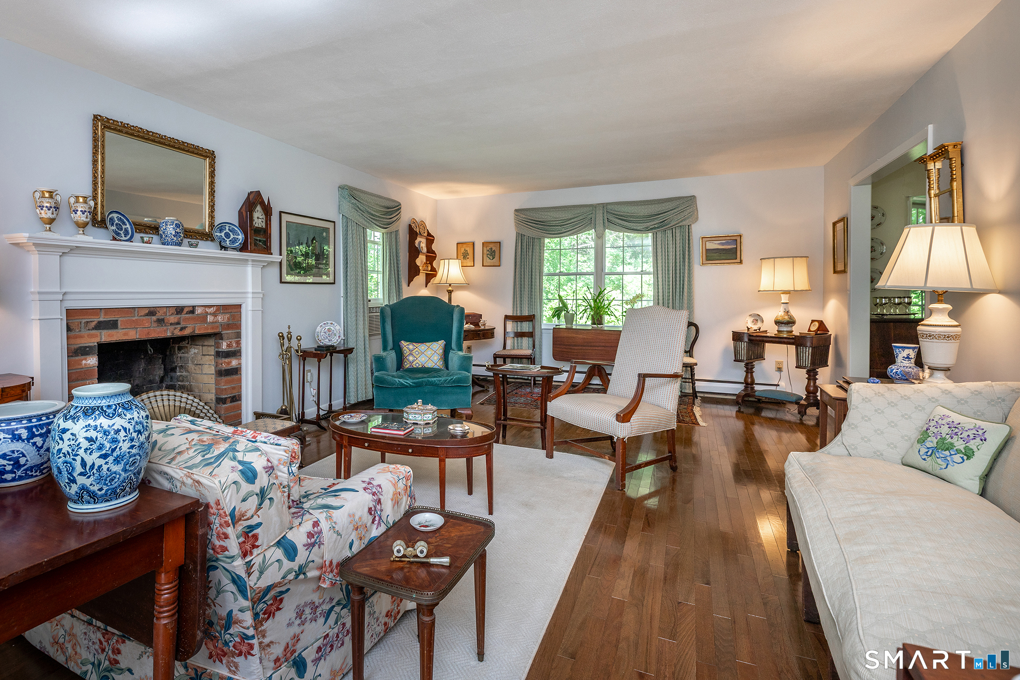318 Romford Road Washington, CT 06777 - Photo 13 of 34 a living room with furniture large window and a fireplace