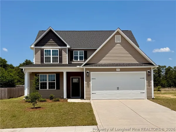 a front view of a house with yard