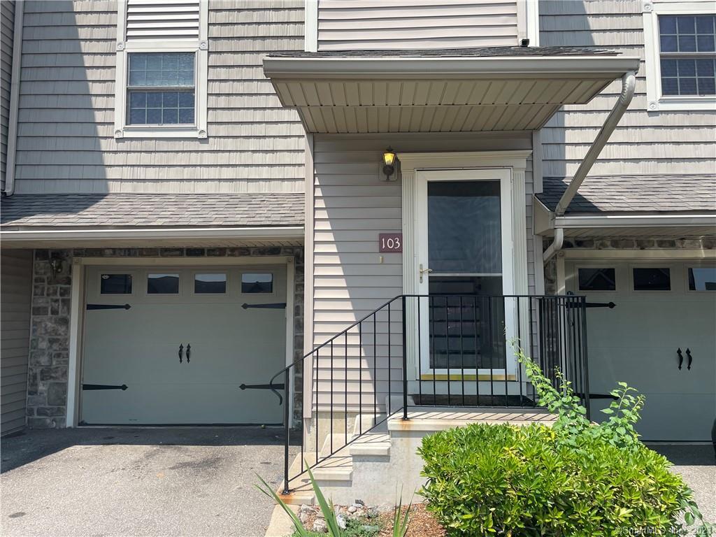 a front view of a house with a garage