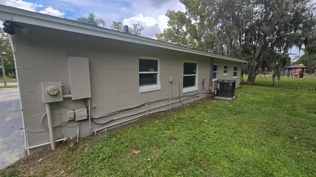 a backyard of a house with seating space