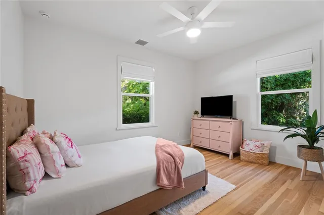 a bathroom with a toilet a sink and a mirror