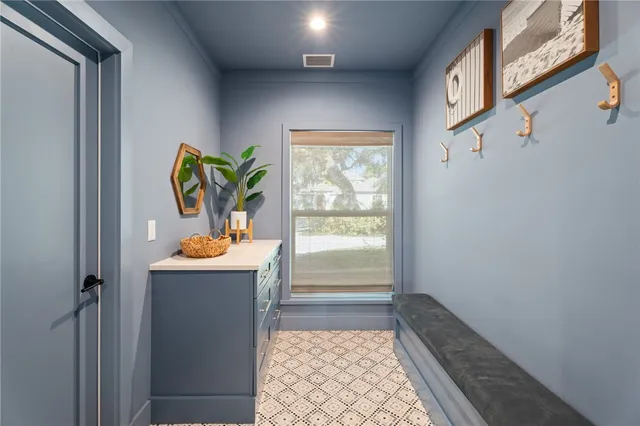 a view of a patio with a table and chairs