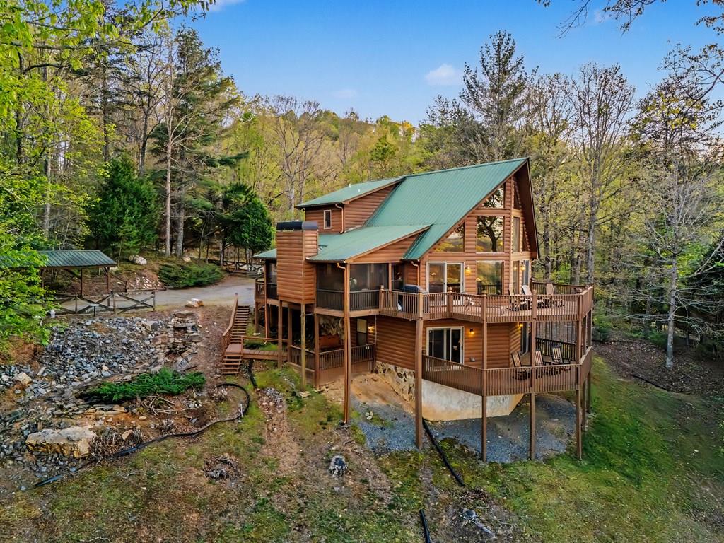431 Sun Rock Mountain Road Blue Ridge, GA 30513 - Photo 1 of 57 an aerial view of a house with a yard