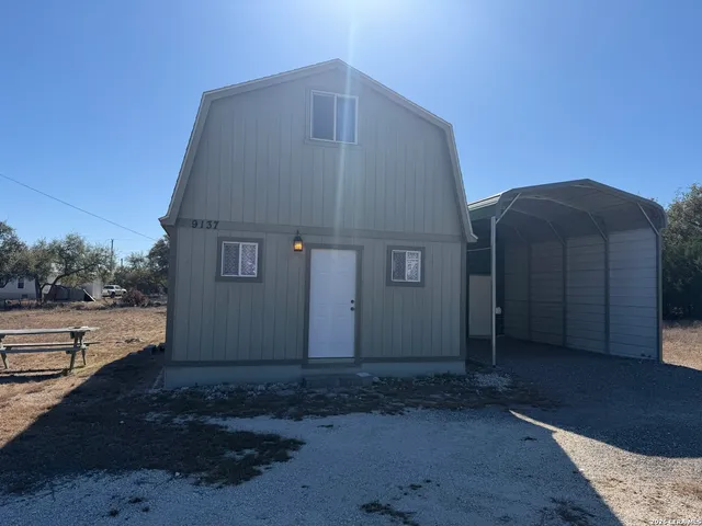 a tall building with trees in the background