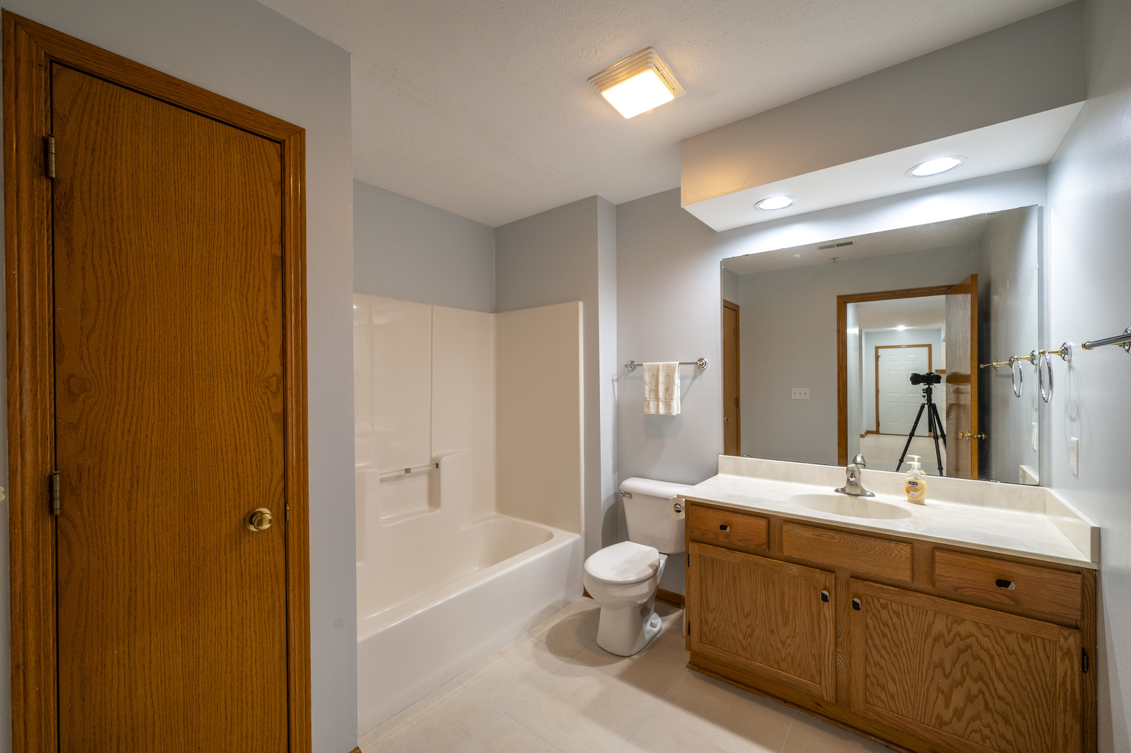 7280 North Alpine Road, Unit 4 Loves Park, IL 61111 - Photo 16 of 17 a spacious bathroom with a double vanity sink toilet mirror and bathtub