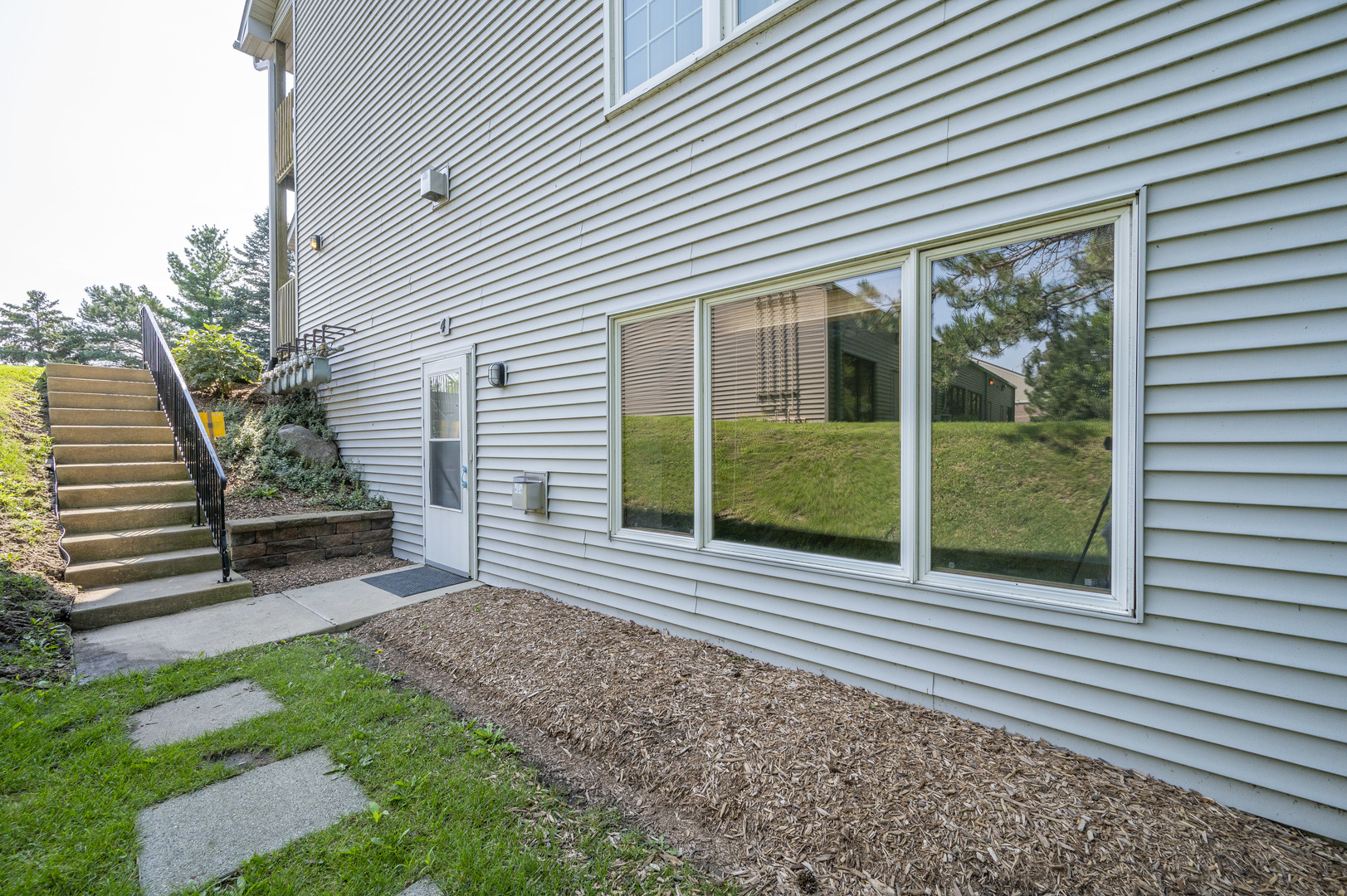 7280 North Alpine Road, Unit 4 Loves Park, IL 61111 - Photo 3 of 17 a view of a house with a backyard