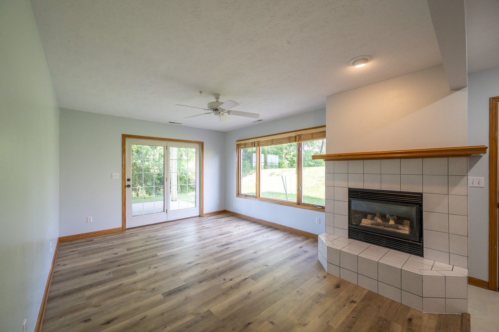 7280 North Alpine Road, Unit 4 Loves Park, IL 61111 - Photo 7 of 17 a view of an empty room with a fireplace and a window