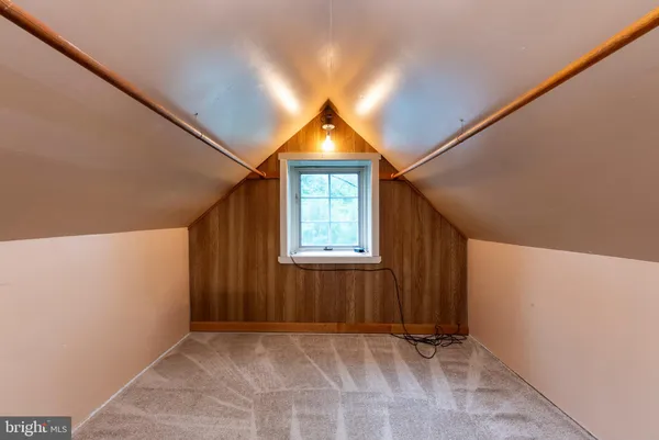 a view of a kitchen with a sink and a window
