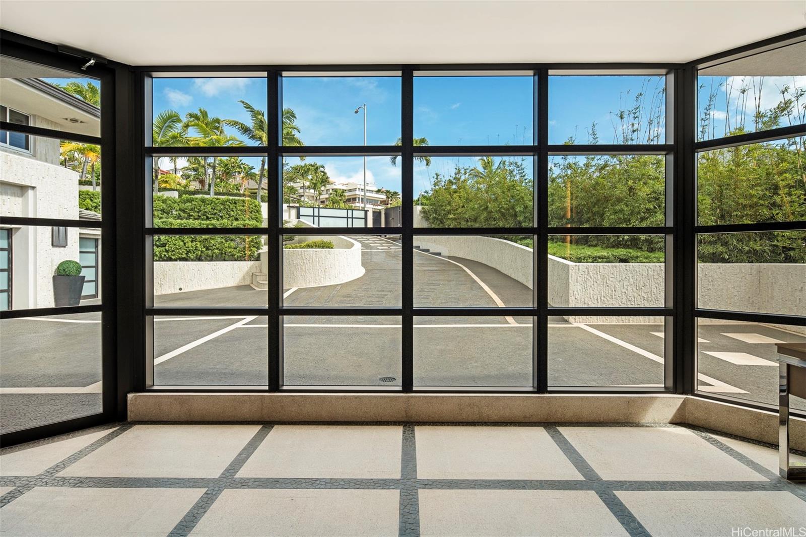 360 Puuikena Drive Honolulu, HI 96821 - Photo 19 of 20 View from the front doors to the gated driveway and parking court.