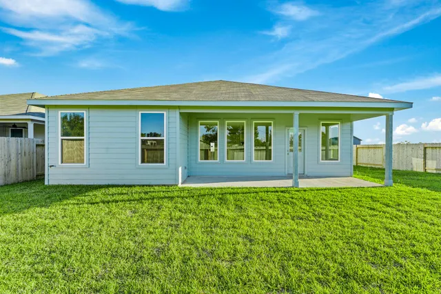 a view of a house with porch and garden