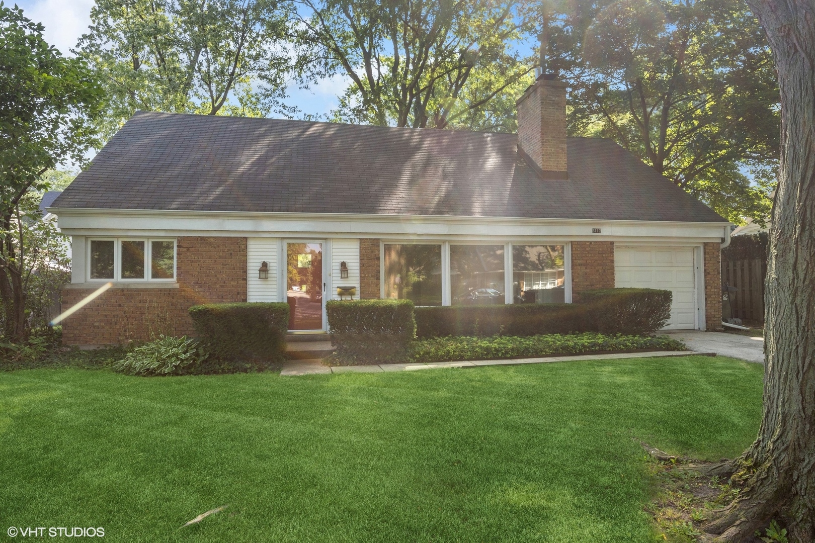 3117 Sprucewood Road Wilmette, IL 60091 - Photo 1 of 16 a front view of house with yard and green space