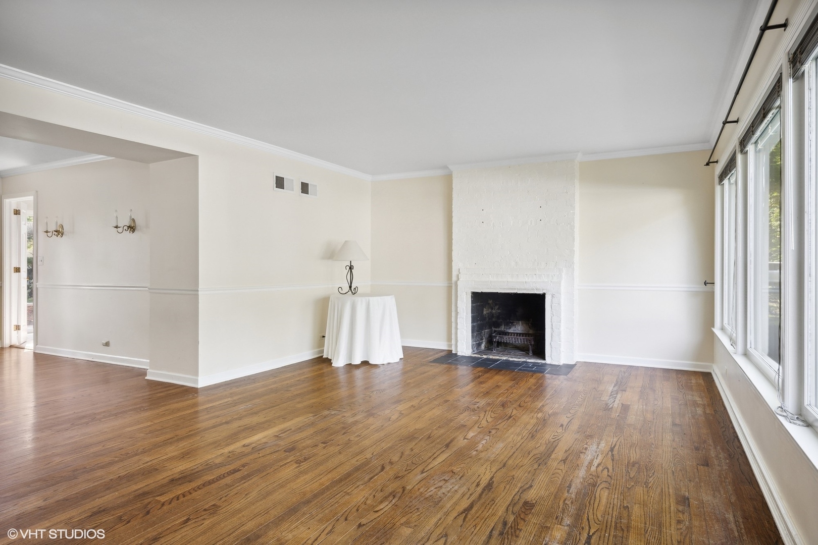 3117 Sprucewood Road Wilmette, IL 60091 - Photo 2 of 16 a view of a livingroom with wooden floor and a fireplace