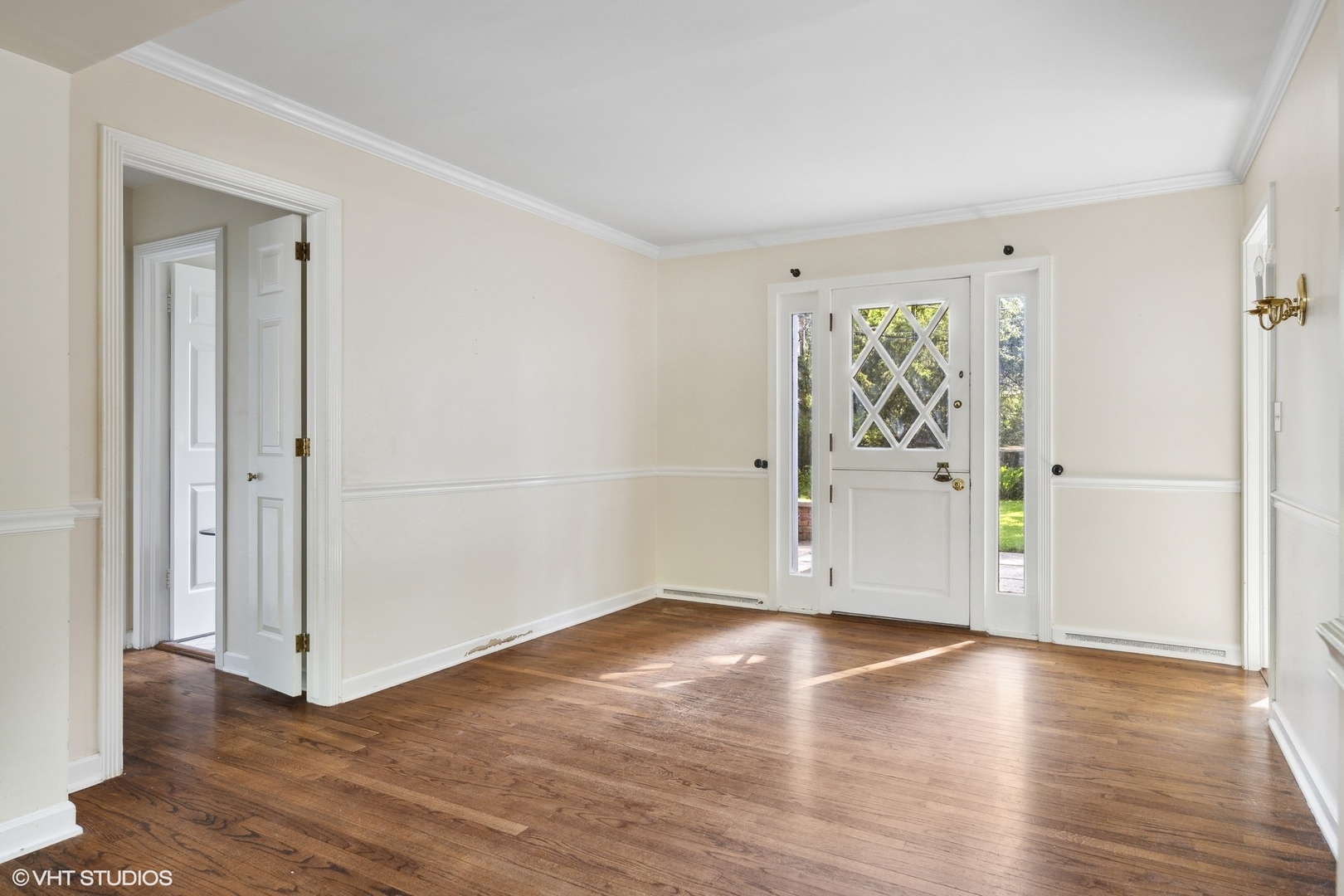 3117 Sprucewood Road Wilmette, IL 60091 - Photo 4 of 16 an empty room with wooden floor and windows