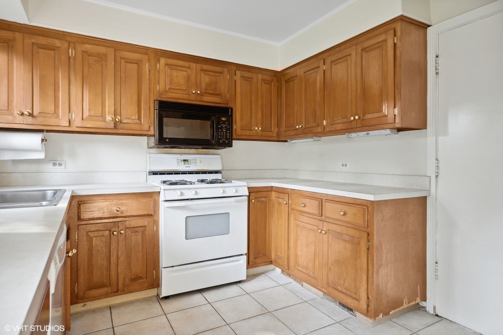 3117 Sprucewood Road Wilmette, IL 60091 - Photo 5 of 16 a kitchen with granite countertop cabinets stainless steel appliances and sink