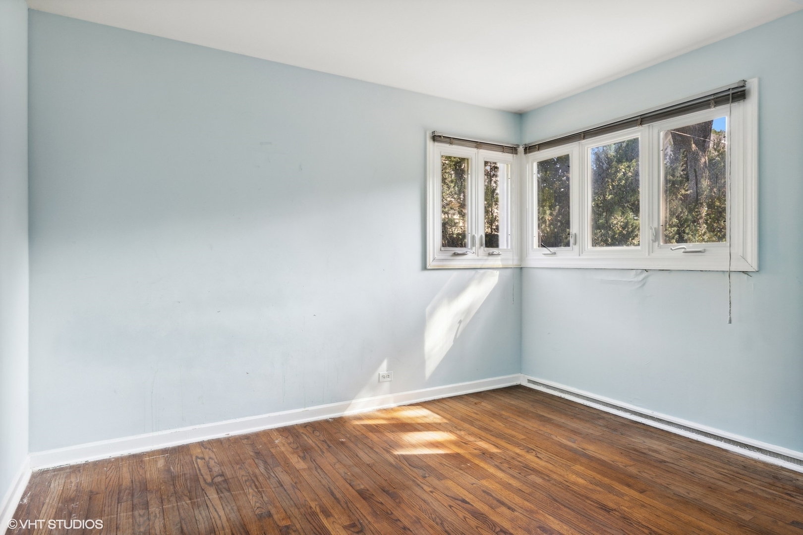 3117 Sprucewood Road Wilmette, IL 60091 - Photo 9 of 16 an empty room with wooden floor and windows