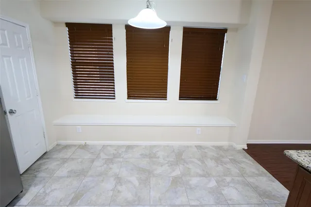 a bathroom with a bathtub and a window