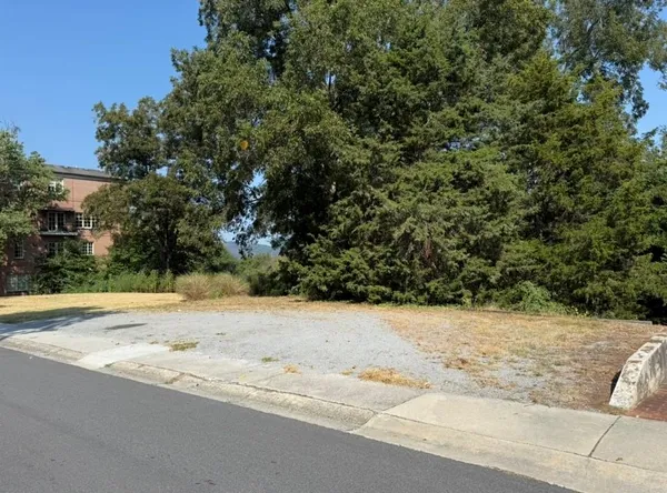 a view of a backyard of the house