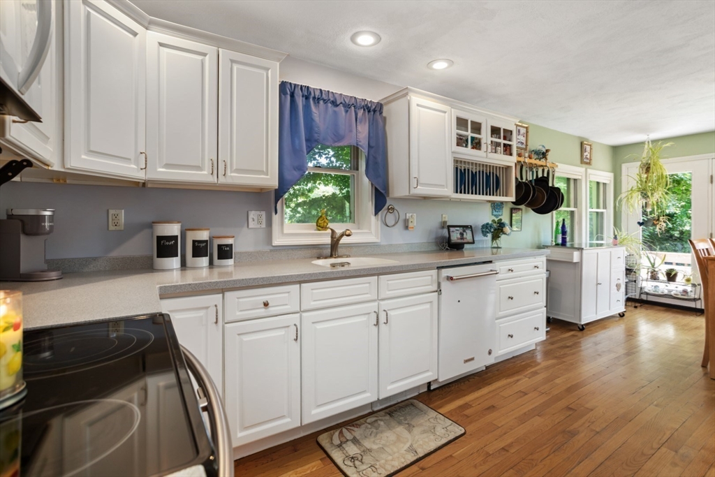 2 Allen Road Billerica, MA 01821 - Photo 13 of 32 a kitchen with white cabinets and a sink