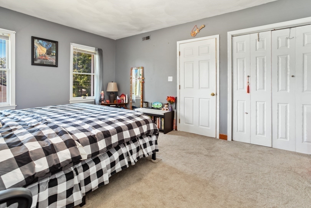 2 Allen Road Billerica, MA 01821 - Photo 23 of 32 a bedroom with a bed and a window